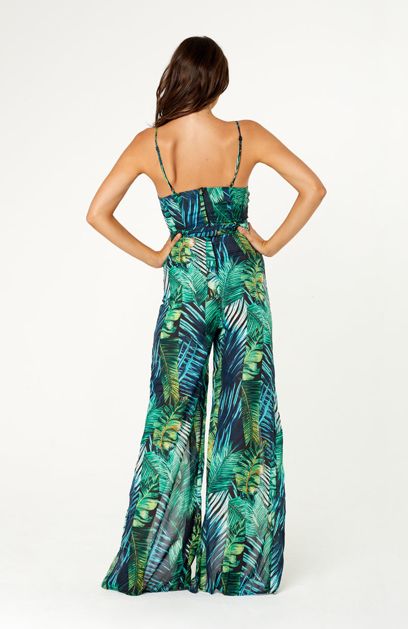 Green palm leaf printed Lovina Leaves Maxi Jumpsuit with deep V-neck, thigh-high splits, self tie waist belt, spaghetti straps and invisible back zip.