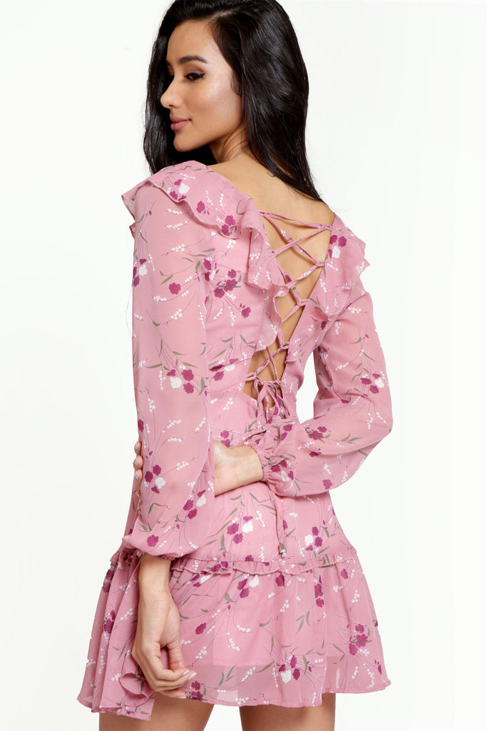 Floral pink mini dress, with a ruffled V-neckline, long lantern sleeves, a full, ruffled hemline and a sexy ruffled lace-up back.
