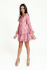 Floral pink mini dress, with a ruffled V-neckline, long lantern sleeves, a full, ruffled hemline and a sexy ruffled lace-up back.