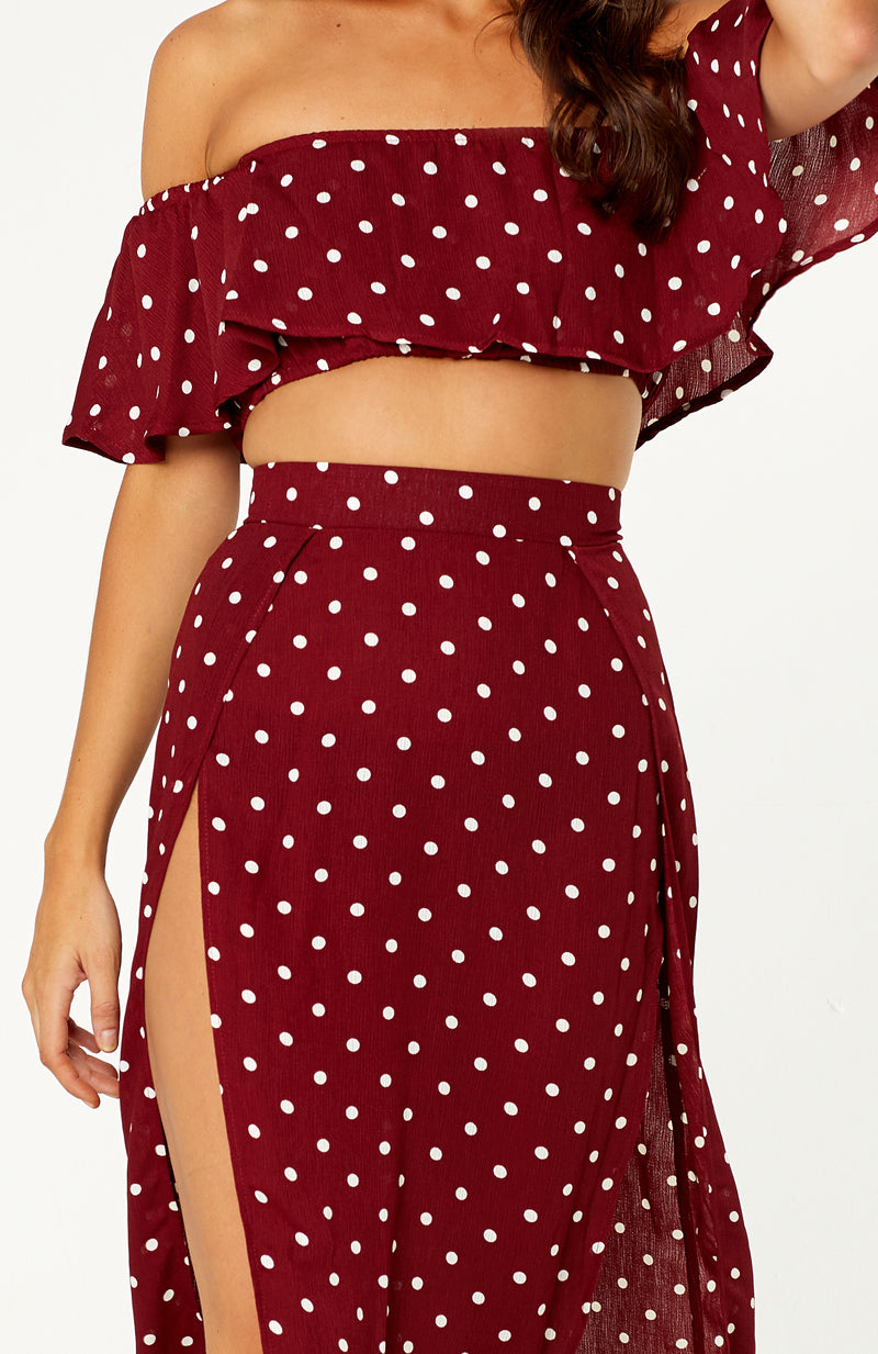 La Plancha Polka Dot Two Piece Set. Features strapless top with off shoulder sleeves, high waisted skirt, two high thigh slits, non-stretch fabric, invisible zip on back of skirt. 