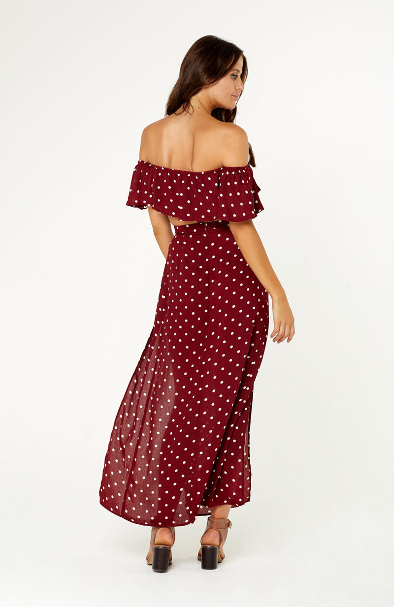 La Plancha Polka Dot Two Piece Set. Features strapless top with off shoulder sleeves, high waisted skirt, two high thigh slits, non-stretch fabric, invisible zip on back of skirt. 